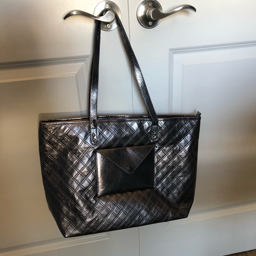 A gray overnight/over the shoulder bag